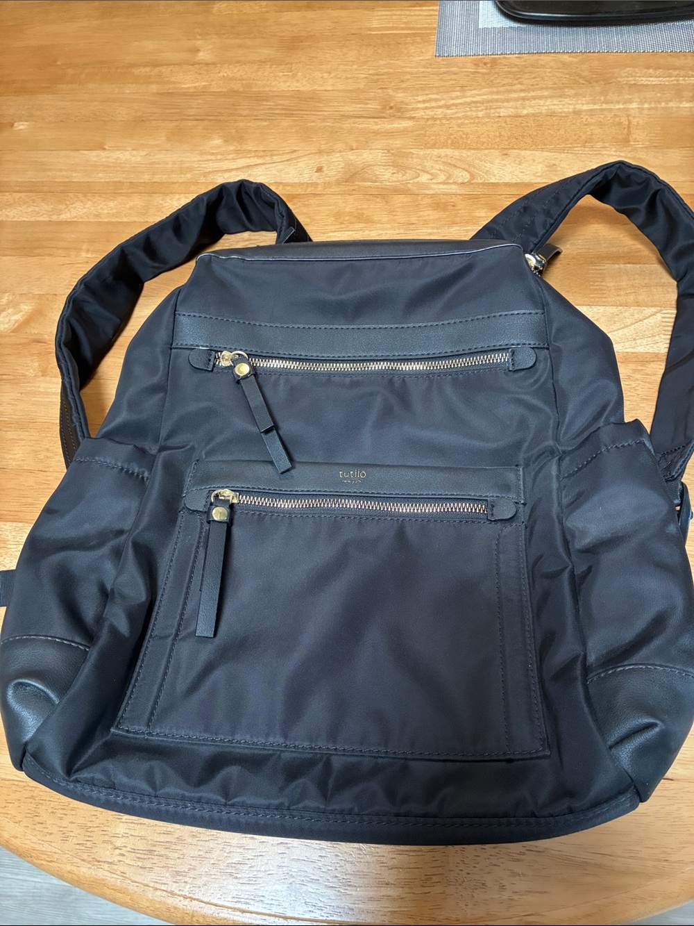 Tutilo Black Men's Backpack with Gold Zipper Accents